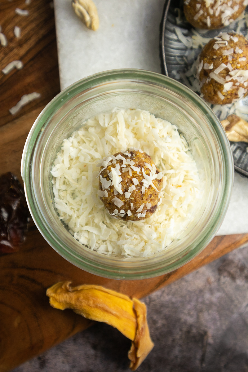 Rolling the bites in coconut